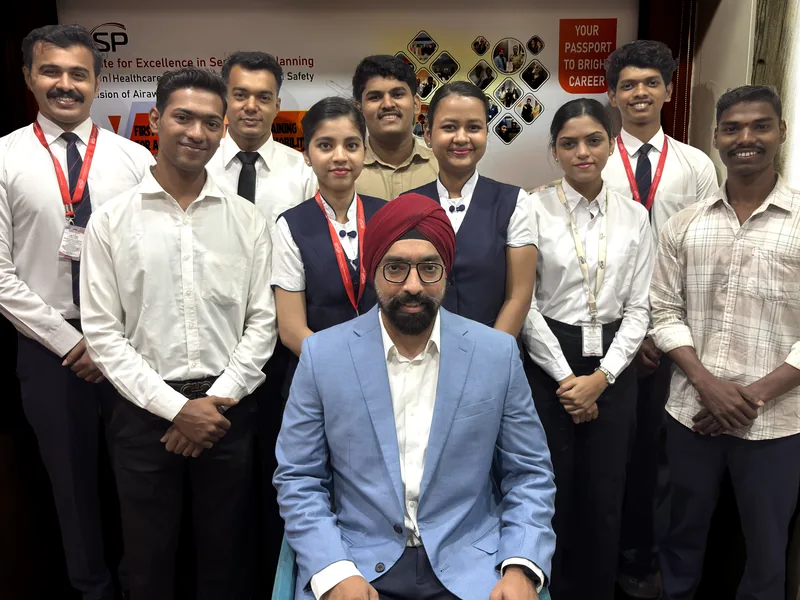 An IESP batch in uniform with their director